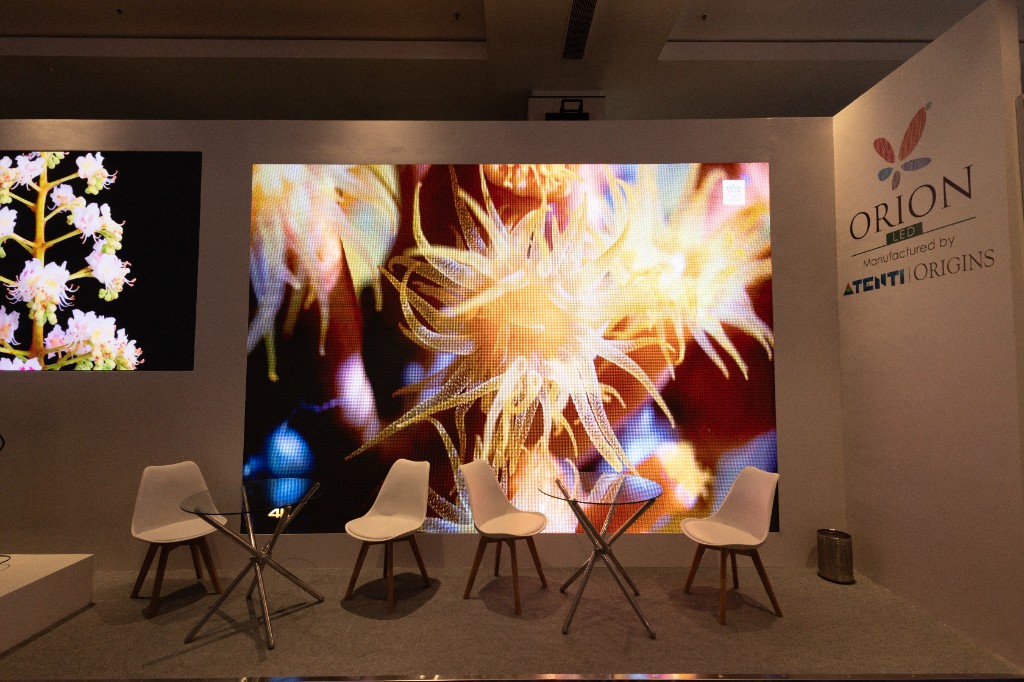 Orion LED Experience Centre booth with immersive display walls and seating